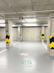 Nový moderní byt 4+kk Choceradská parkovací místnost
